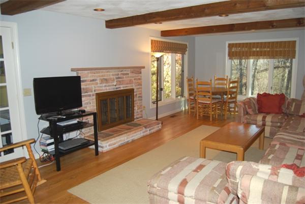 237 East Emerson Road Lexington, MA 02420 - Photo 8 of 22 a bedroom with furniture and a fireplace