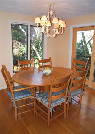 237 East Emerson Road Lexington, MA 02420 - Photo 10 of 22 a view of a dining room with furniture a chandelier and wooden floor