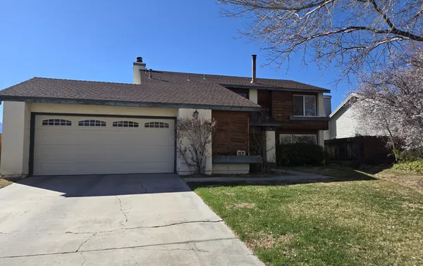 a front view of a house with a garage