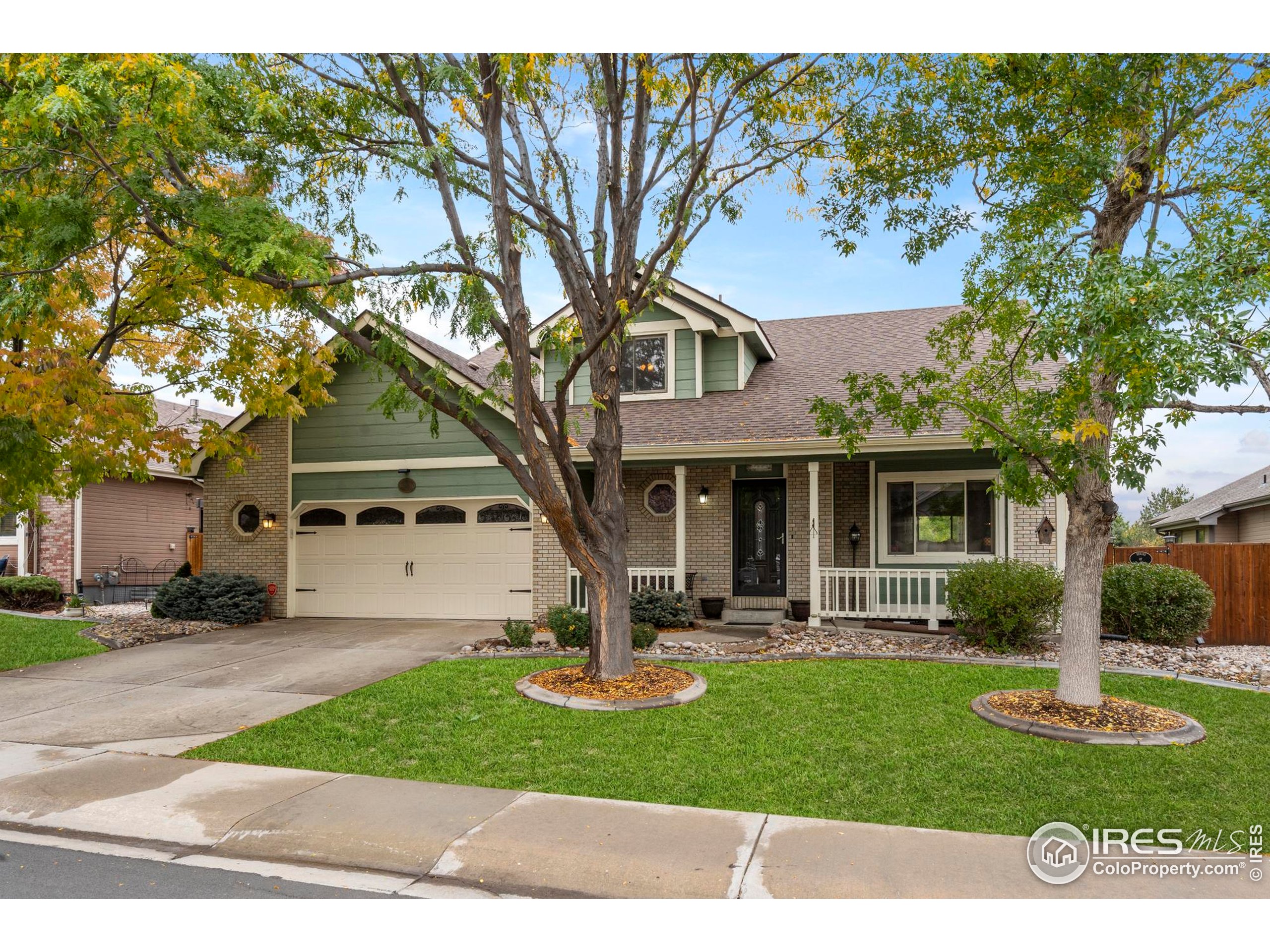 1808 Silvergate Road Fort Collins, CO 80526 - Photo 1 of 42 a front view of a house with a yard and trees