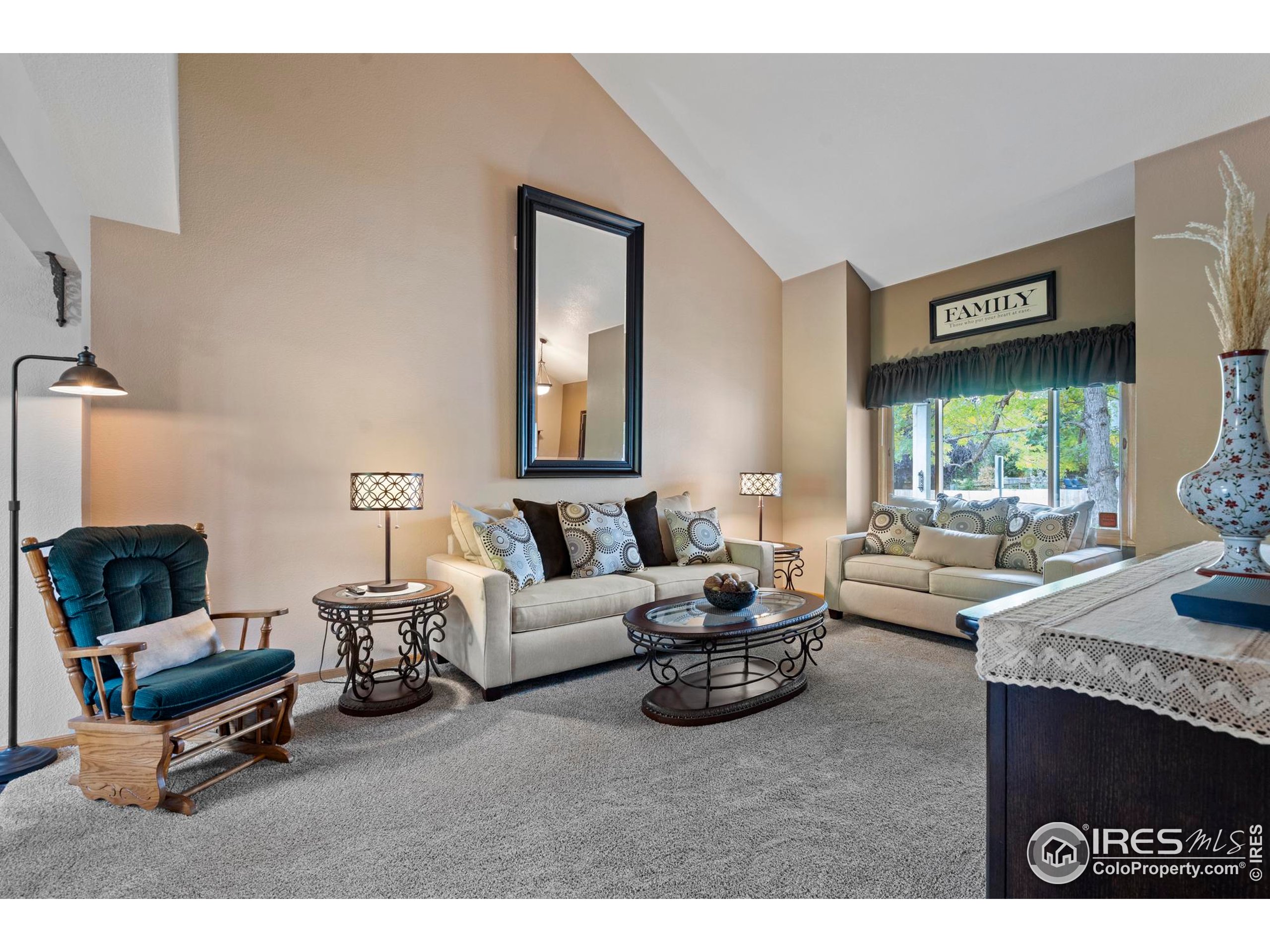 1808 Silvergate Road Fort Collins, CO 80526 - Photo 11 of 42 a living room with furniture and a large window