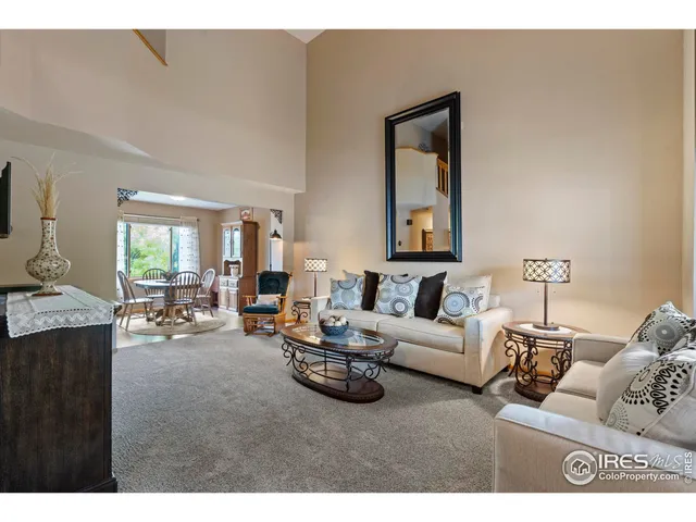 a living room with furniture and a painting