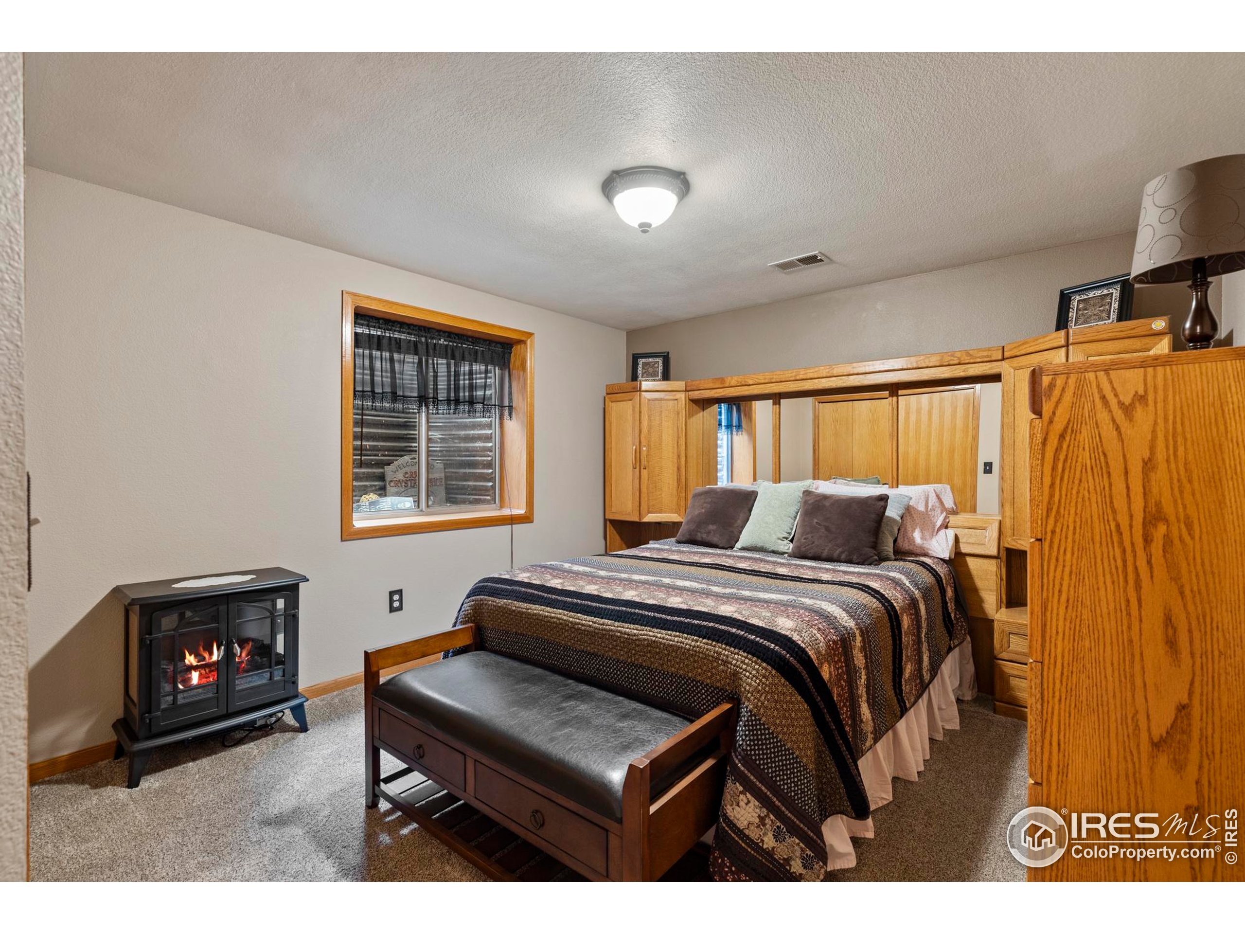 1808 Silvergate Road Fort Collins, CO 80526 - Photo 26 of 42 a bed room with a bed and a tv
