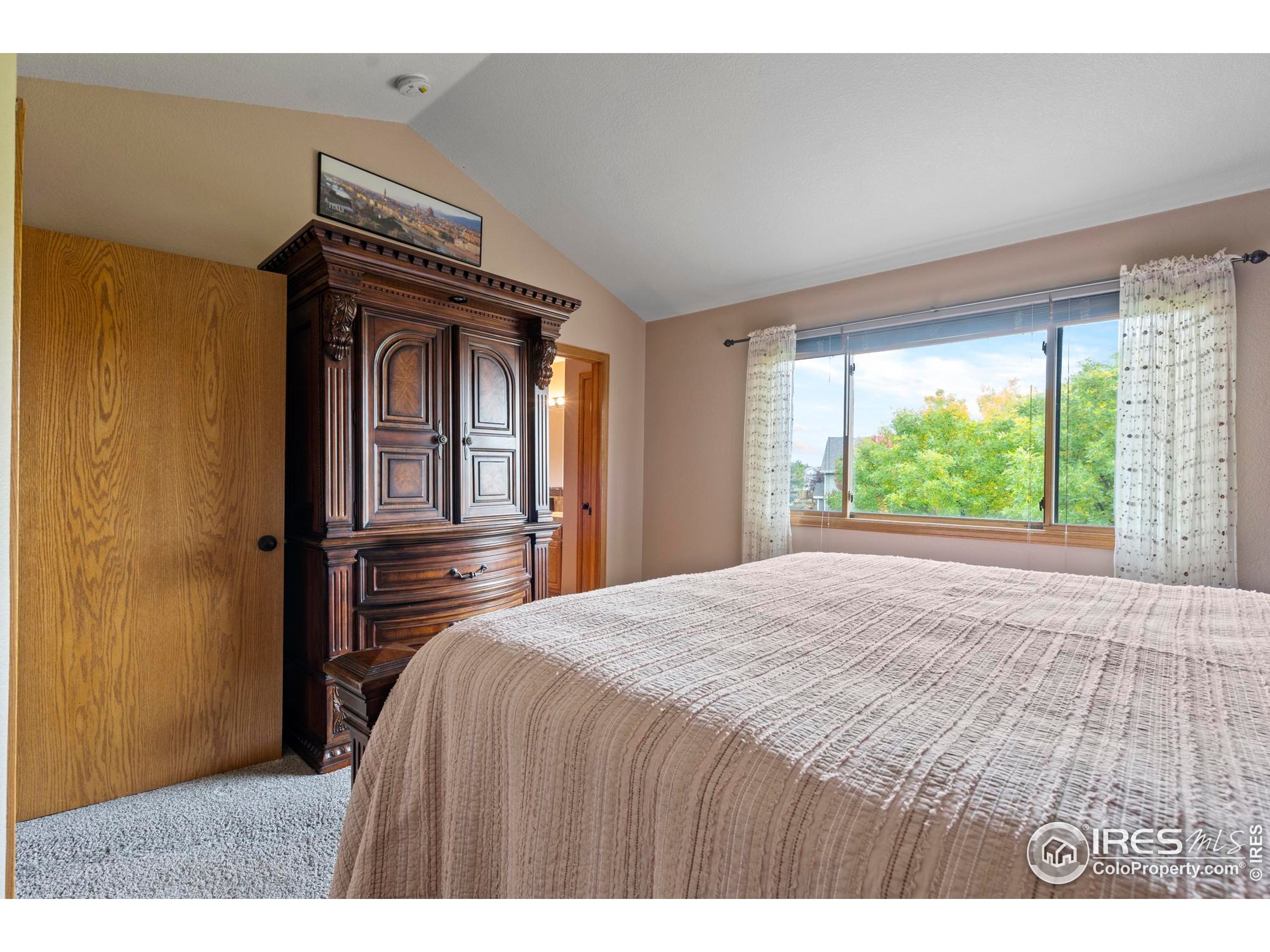 1808 Silvergate Road Fort Collins, CO 80526 - Photo 27 of 42 a bedroom with a bed and a window