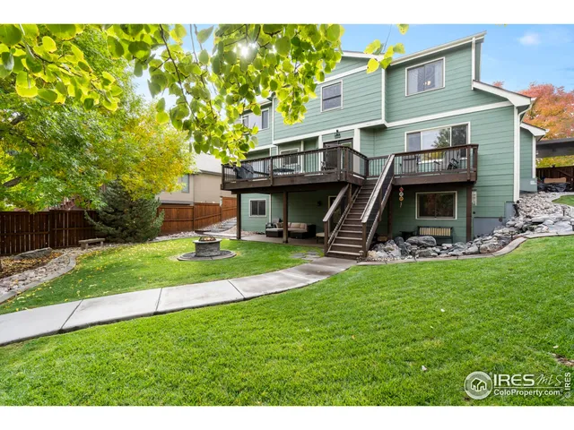 a view of a house with a yard porch and sitting area