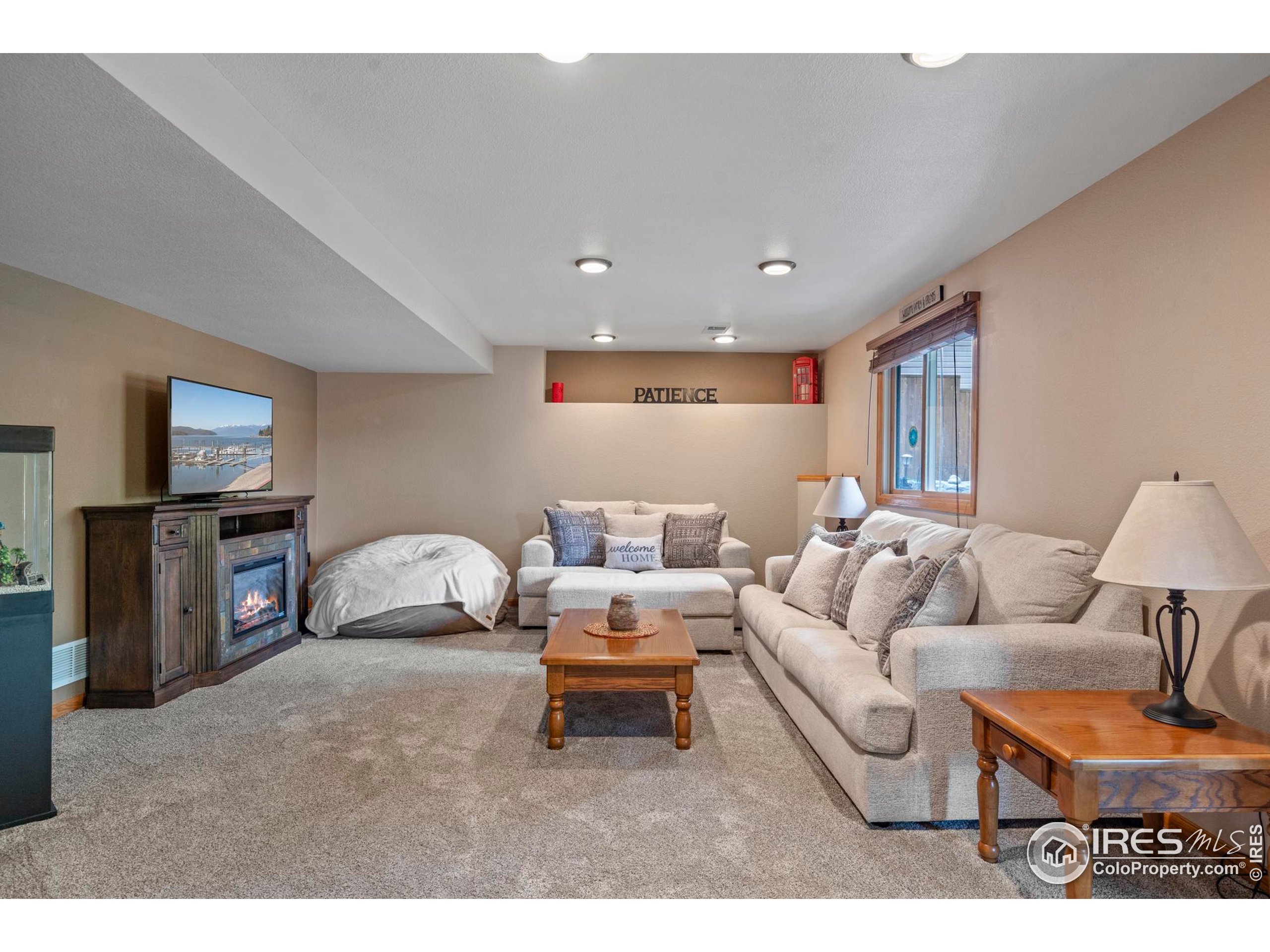 1808 Silvergate Road Fort Collins, CO 80526 - Photo 7 of 42 a living room with furniture and a flat screen tv
