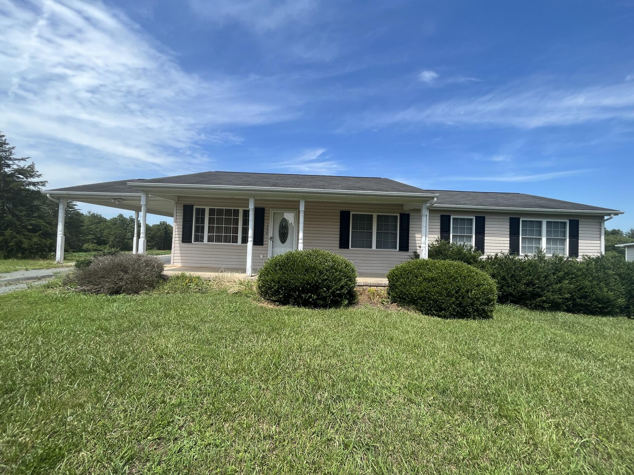 1550 Dry Bridge Road Chatham, VA 24531 - Photo 1 of 16 a view of a house with backyard and porch