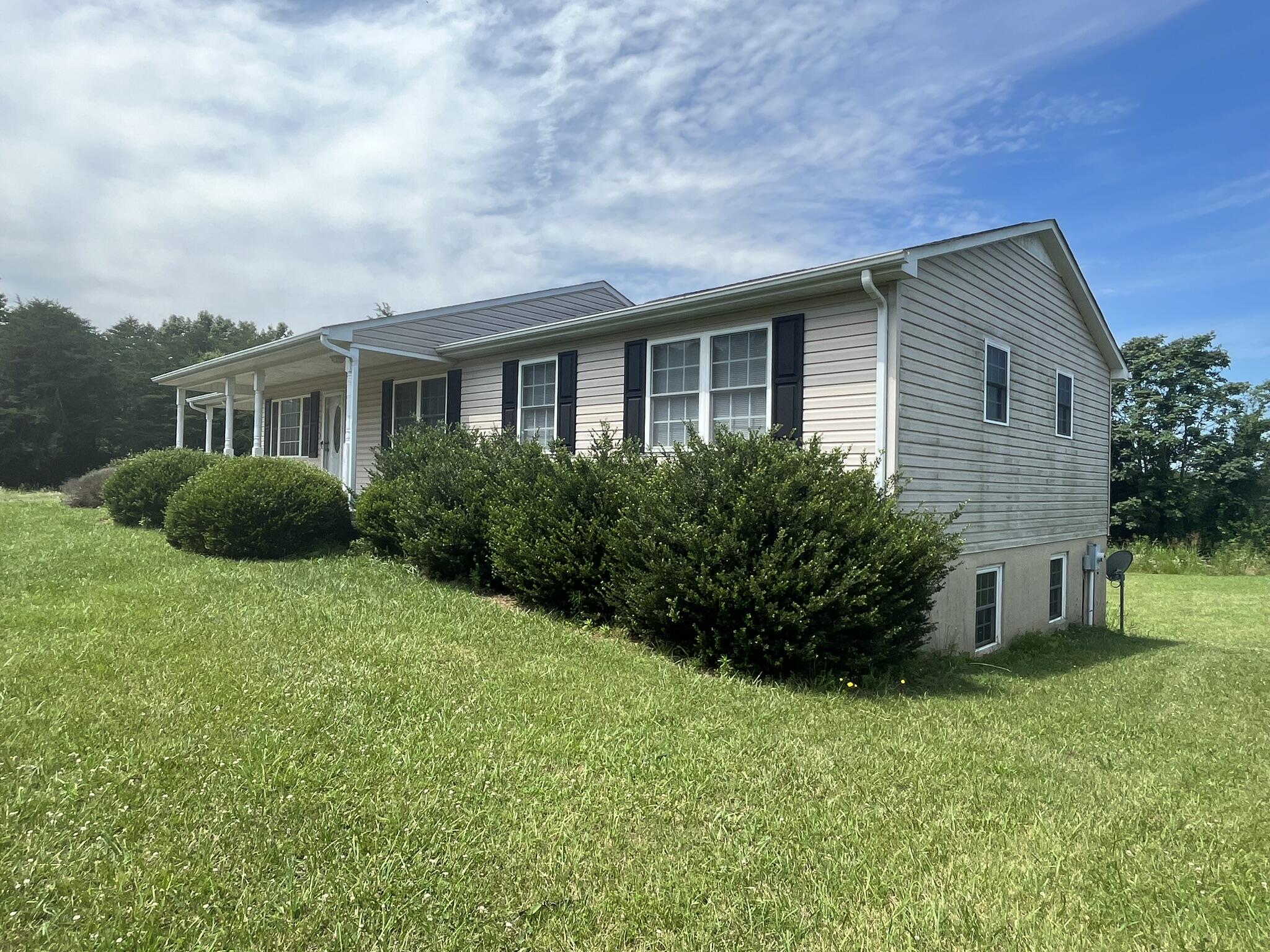 1550 Dry Bridge Road Chatham, VA 24531 - Photo 2 of 16 a house view with a garden space