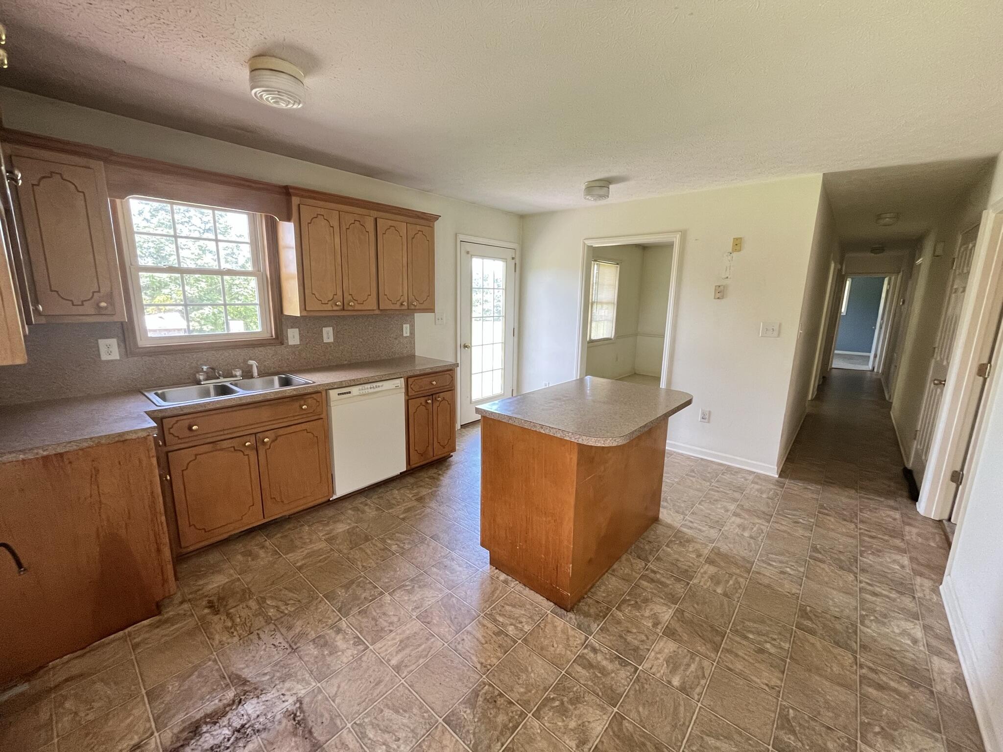 1550 Dry Bridge Road Chatham, VA 24531 - Photo 3 of 16 a large kitchen with stainless steel appliances granite countertop a sink stove and cabinets