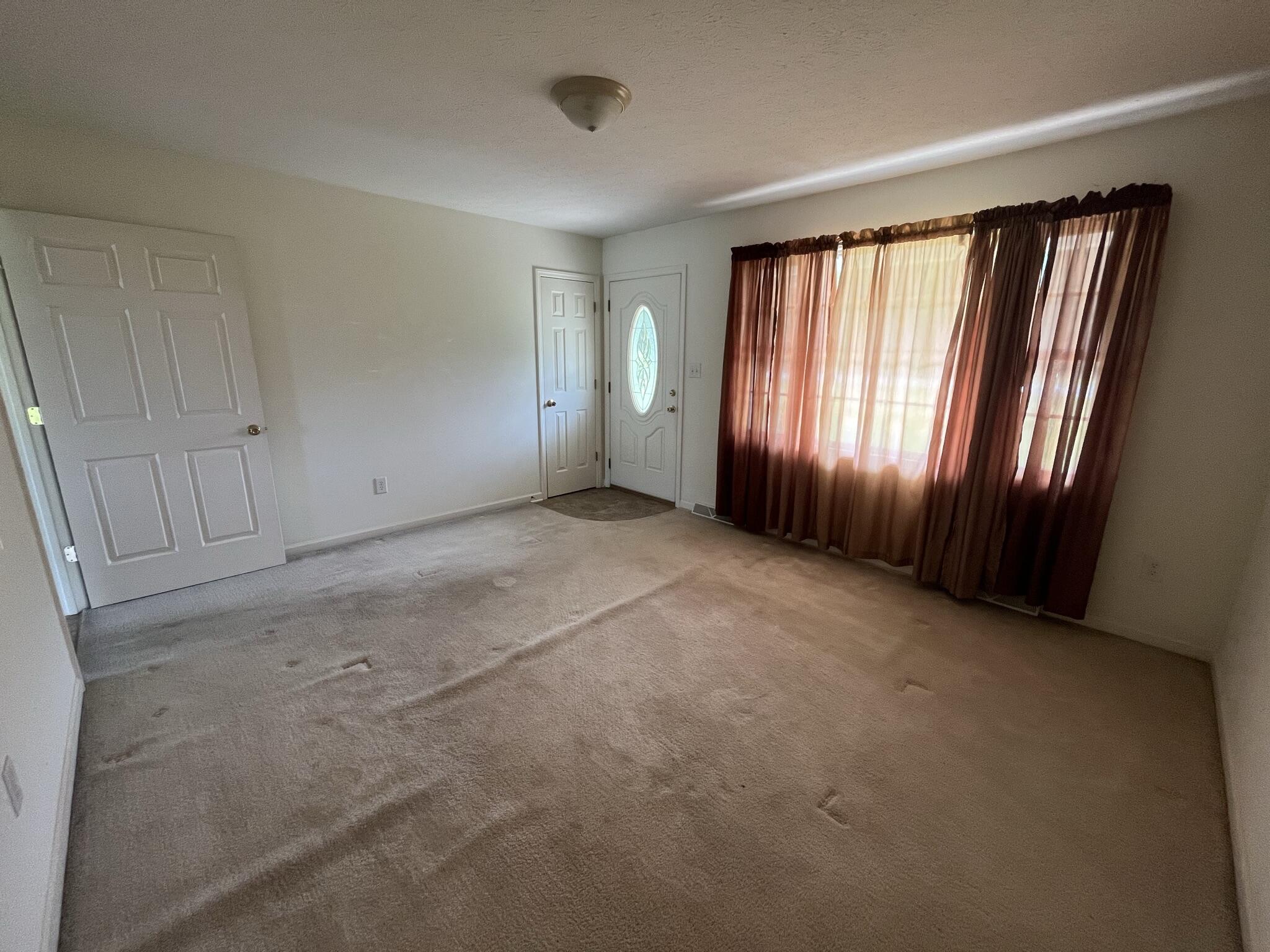 1550 Dry Bridge Road Chatham, VA 24531 - Photo 5 of 16 an empty room with windows and closet area