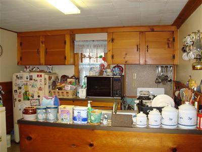 19 Park Road Mashpee, MA 02649 - Photo 3 of 10 a kitchen with a sink and a stove top oven