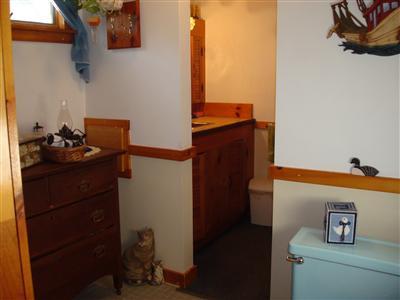 19 Park Road Mashpee, MA 02649 - Photo 5 of 10 a bathroom with a sink and a mirror