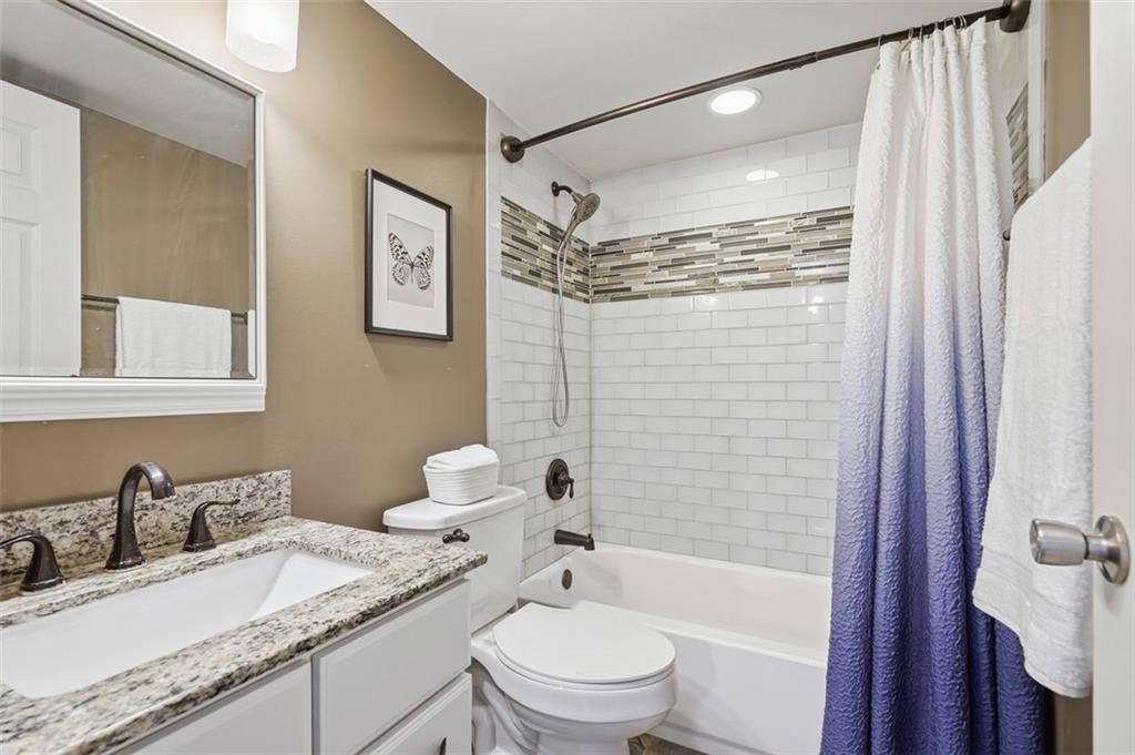 5 Bayard Road, Unit 520 Pittsburgh, PA 15213 - Photo 18 of 25 a bathroom with a granite countertop sink toilet and shower