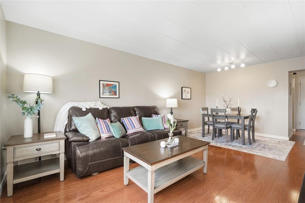 5 Bayard Road, Unit 520 Pittsburgh, PA 15213 - Photo 3 of 25 a living room with furniture and a chandelier