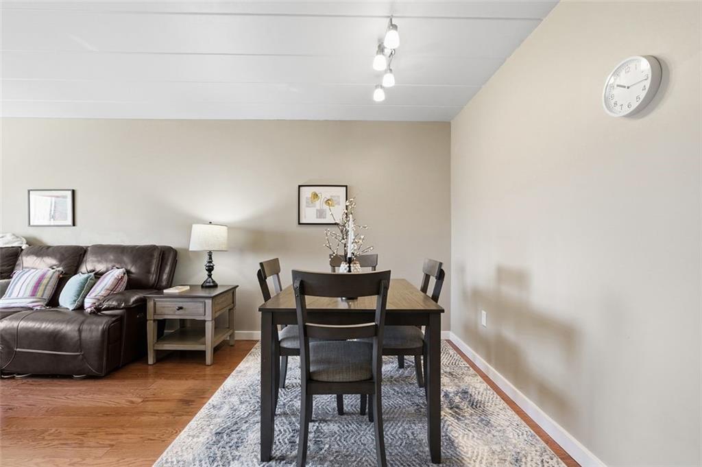 5 Bayard Road, Unit 520 Pittsburgh, PA 15213 - Photo 7 of 25 a living room with furniture and a wooden floor