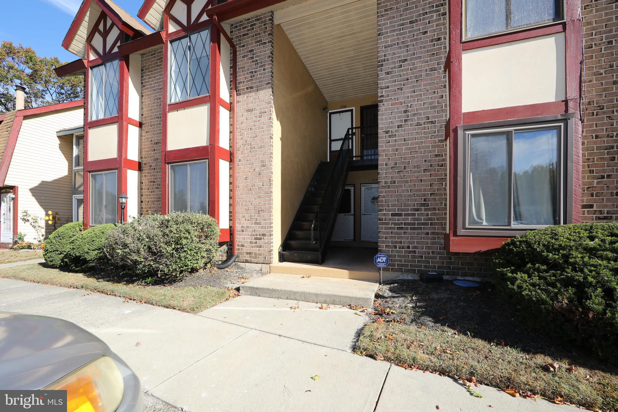 108 Chelsea Circle Clementon, NJ 08021 - Photo 3 of 19 a view of a brick house with potted plants