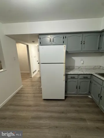 a utility room with cabinets washer and dryer