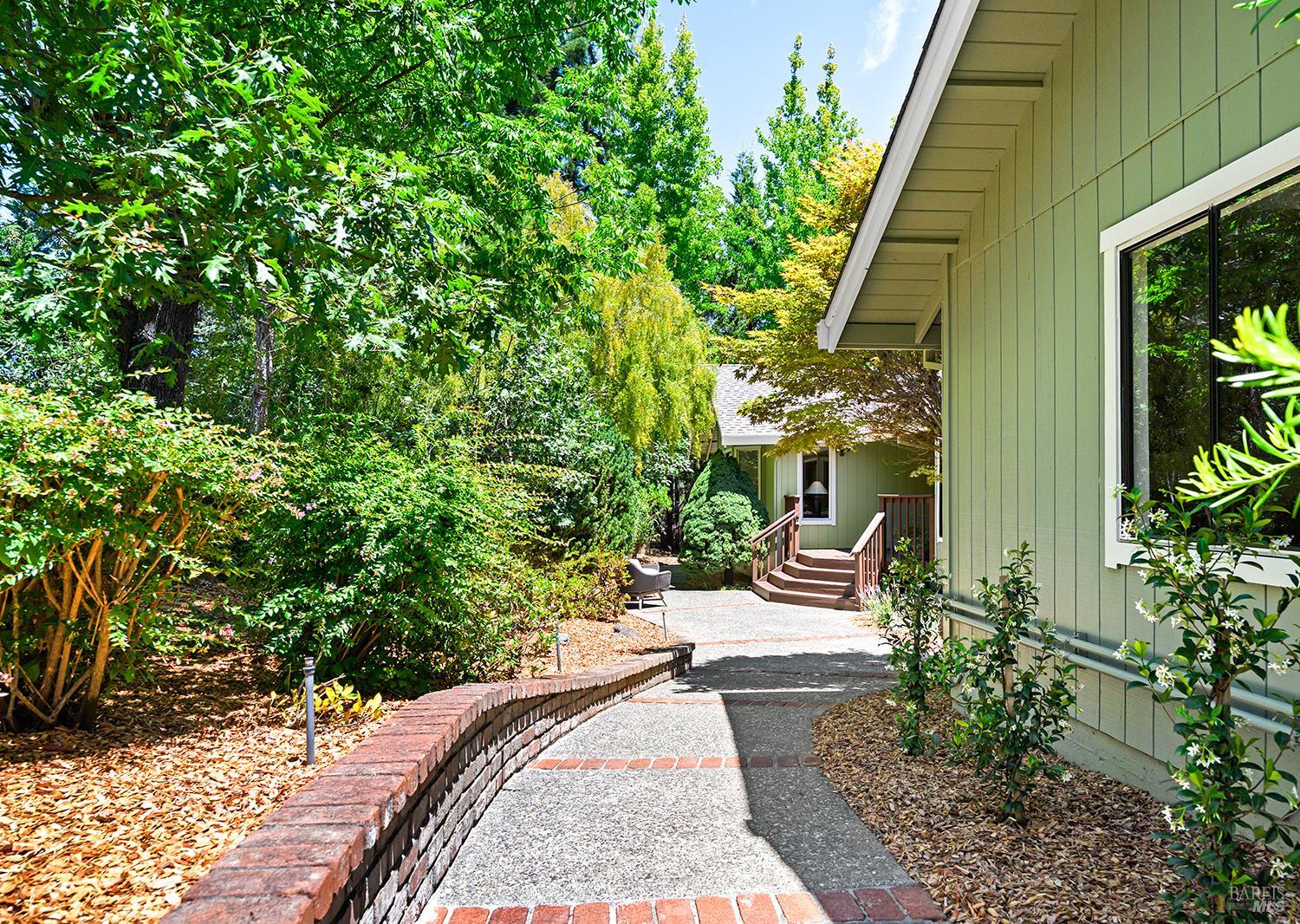 7595 Giusti Road Forestville, CA 95436 - Photo 4 of 41 a wooden bench sitting in front of a house