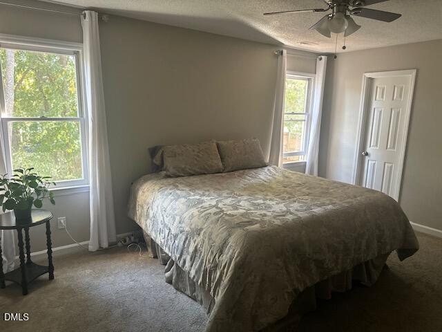 2704 Rockbridge Court Raleigh, NC 27604 - Photo 14 of 15 a large bed sitting in a bedroom next to a window