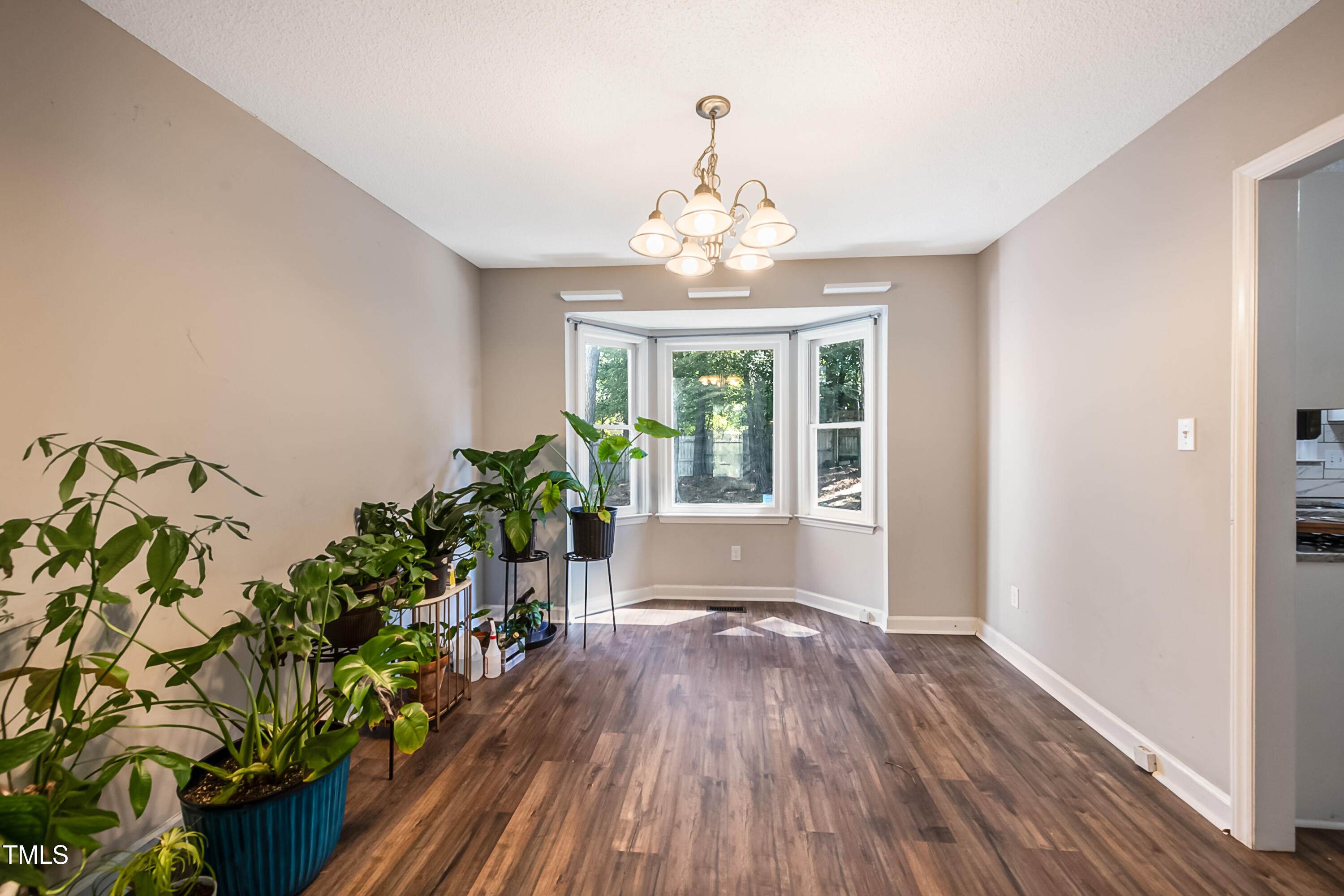 2704 Rockbridge Court Raleigh, NC 27604 - Photo 3 of 15 wooden floor in an empty room with a window