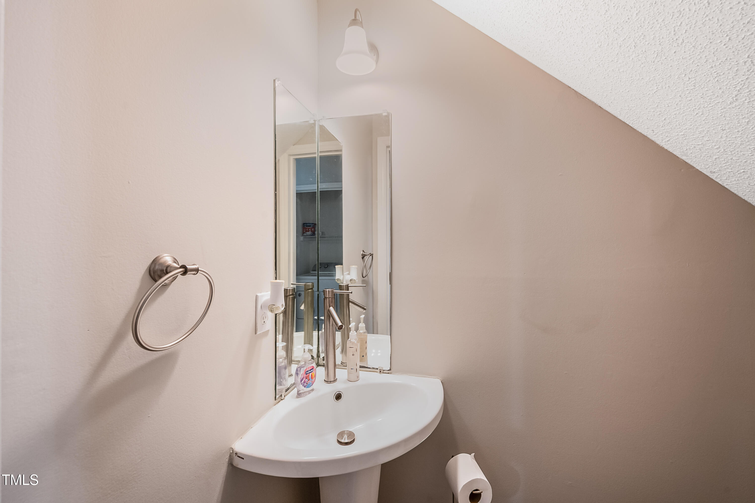 2704 Rockbridge Court Raleigh, NC 27604 - Photo 10 of 15 a bathroom with a sink and a mirror