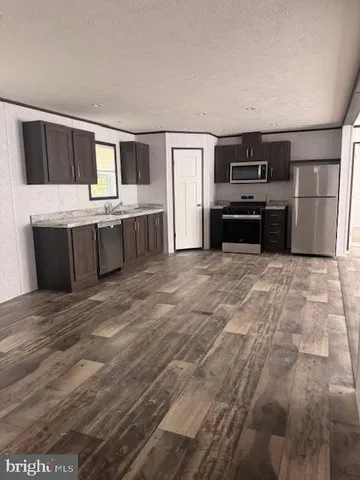 a view of a kitchen with a sink