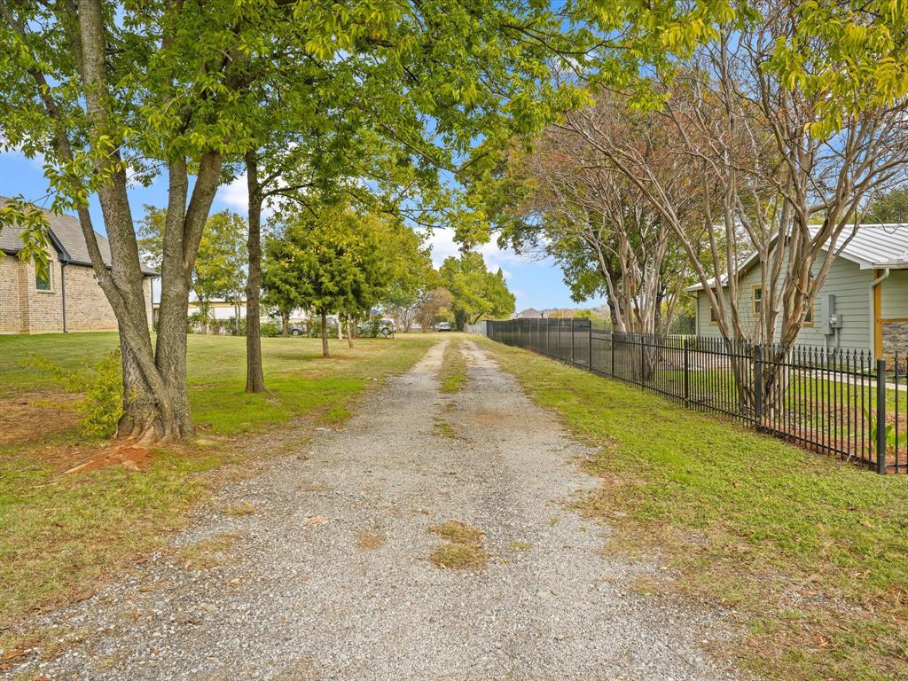 3107 Russell Road Arlington, TX 76001 - Photo 1 of 1 a view of yard with tree and wooden fence
