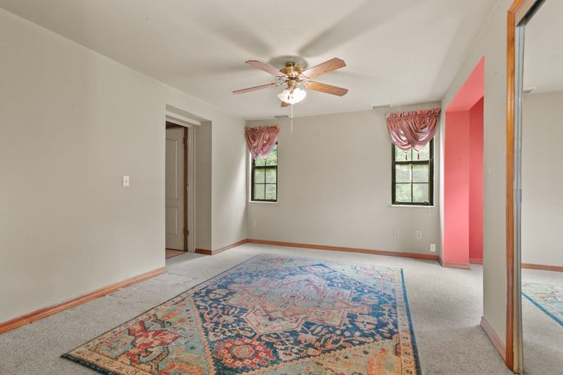 116 Loyola Road St. Augustine, FL 32086 - Photo 6 of 41 a view of an empty room with window and wooden floor
