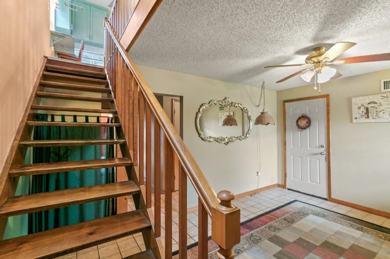 116 Loyola Road St. Augustine, FL 32086 - Photo 9 of 41 a view of staircase with white walls and a window