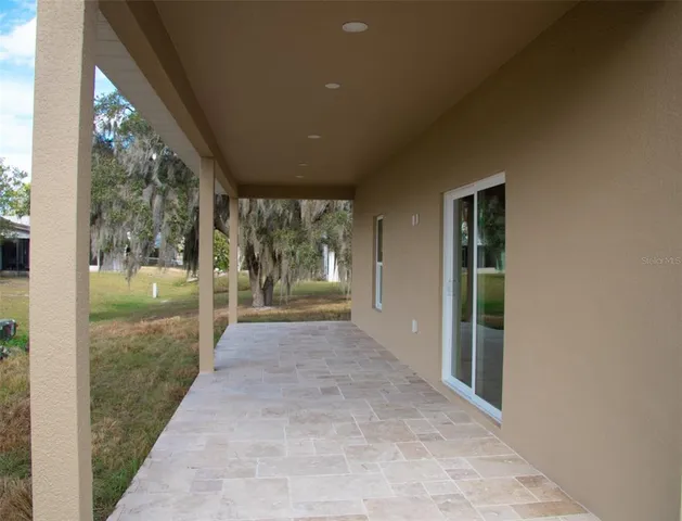 a view of a porch and garden