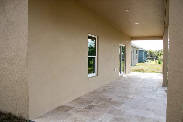 a view of an empty room and window