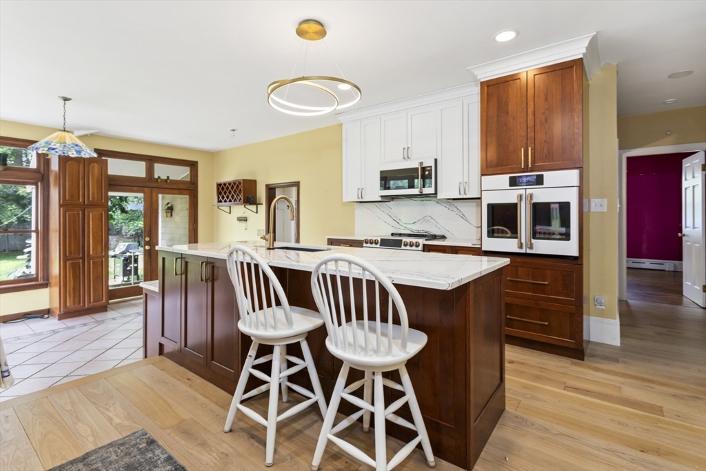 29 Boulevard Road Dedham, MA 02026 - Photo 5 of 34 a view of a dining room with furniture and wooden floor
