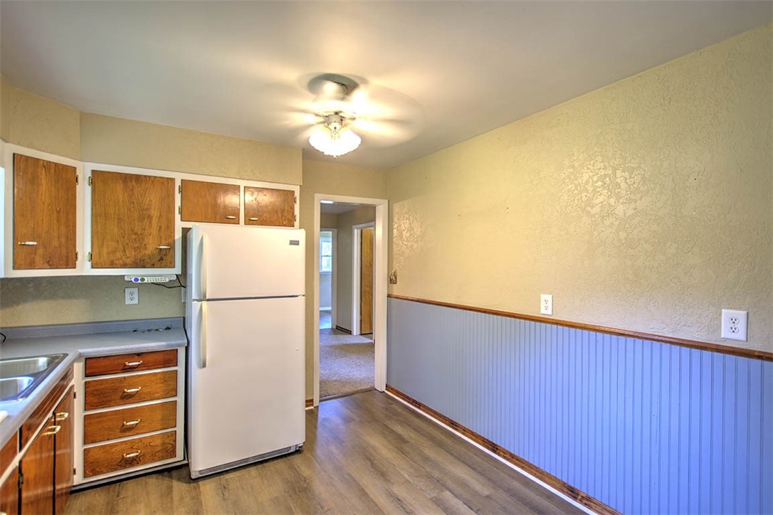3454 North Christine Drive Decatur, IL 62526 - Photo 6 of 23 a view of kitchen with refrigerator and wooden floor