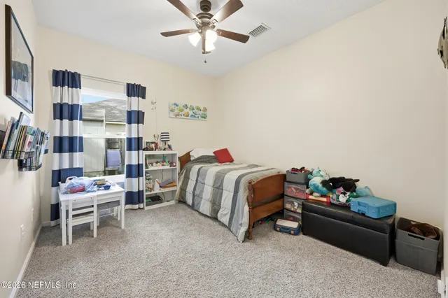 a view of utility room and bedroom