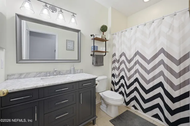 a view of a livingroom with workspace and a window