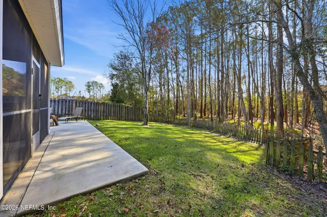 a backyard of a building with trees