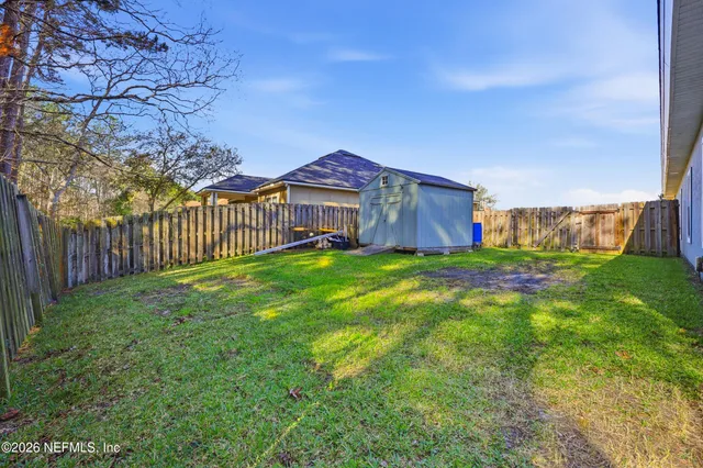 a view of a backyard with a small cabin
