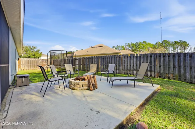 a yellow house with a big yard