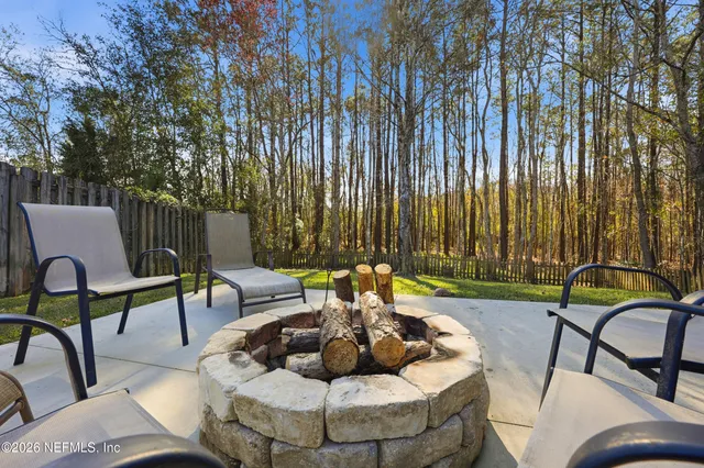 a view of two chairs in the patio