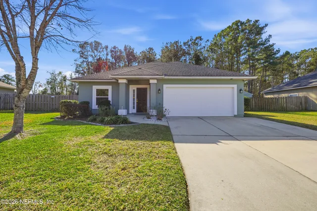 a view of a couches and dinning table in patio