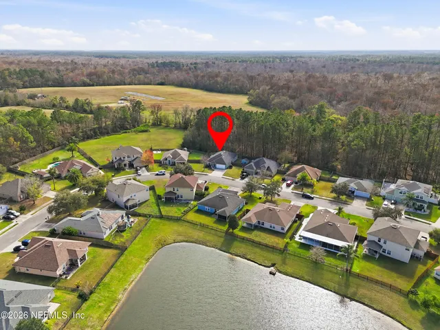 an aerial view of a house with garden space and outdoor space
