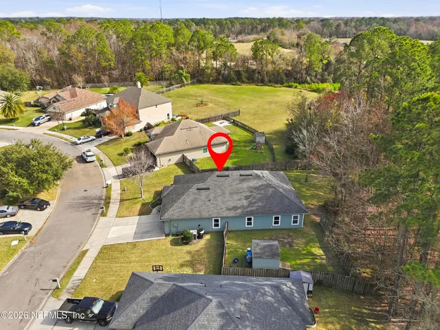 an aerial view of a house with yard swimming pool and outdoor seating