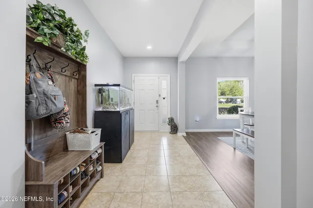 a view of a livingroom with furniture and a ceiling fan