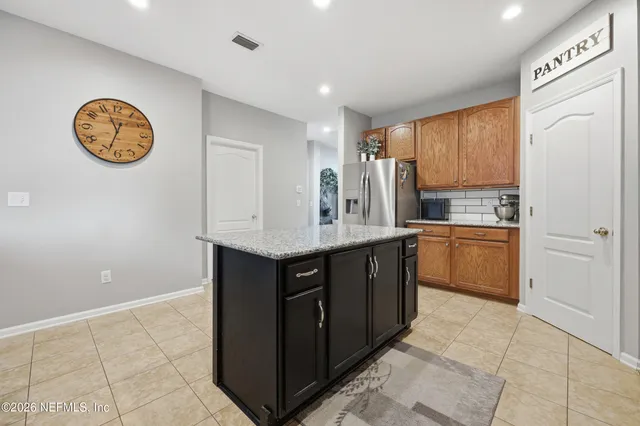 a kitchen with a sink and a stove top oven
