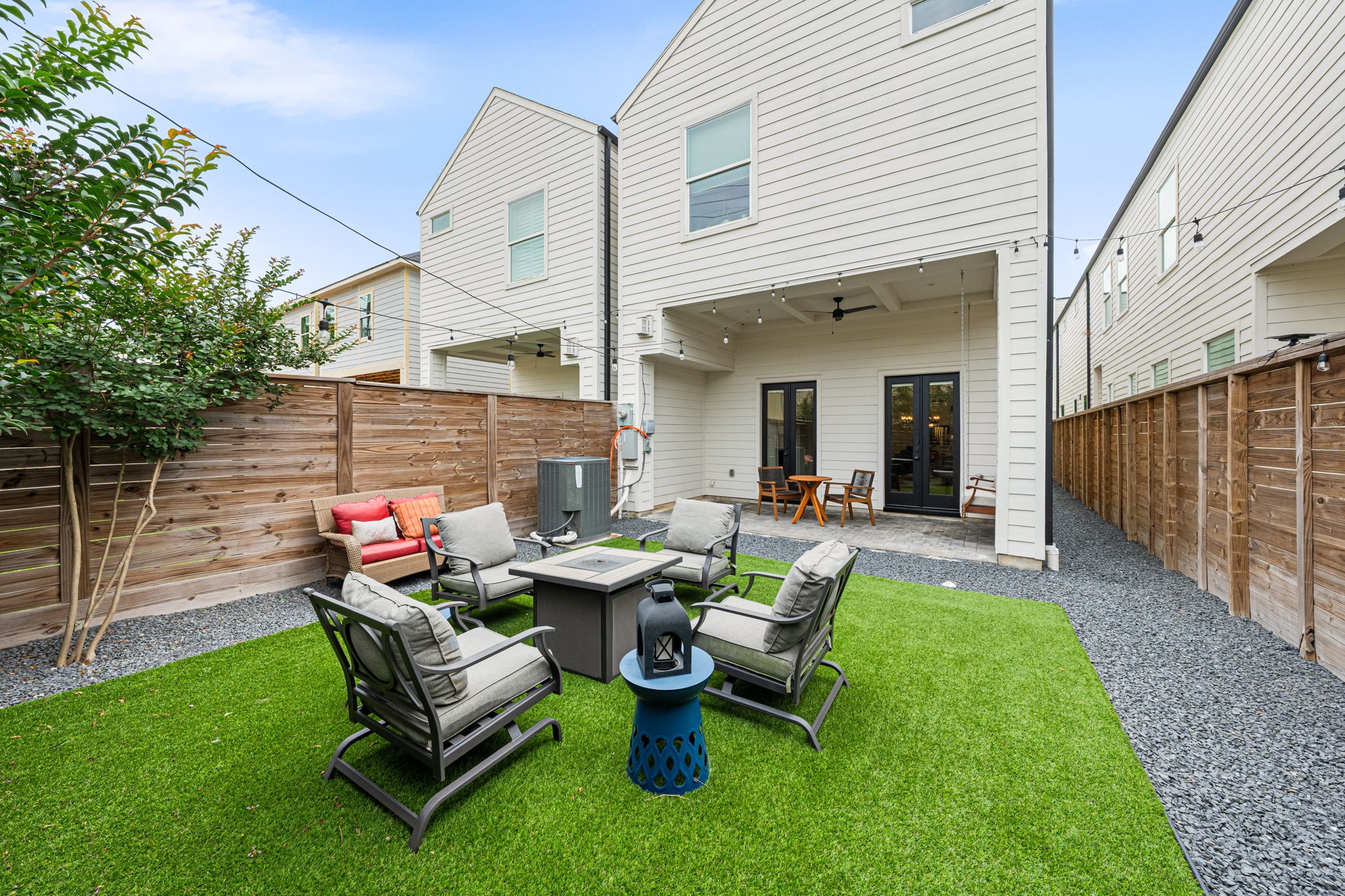 533 West 27th Street Houston, TX 77008 - Photo 21 of 22 Turfed backyard framed by crepe myrtles creates a private, low-maintenance outdoor setting with space for entertaining and relaxing.