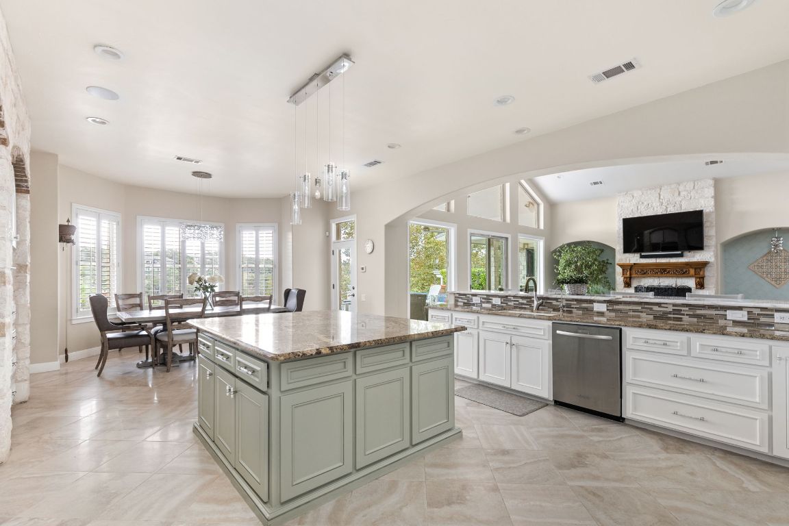 805 Brooks Hollow Road Lakeway, TX 78734 - Photo 38 of 38 a kitchen with sink stove and cabinets