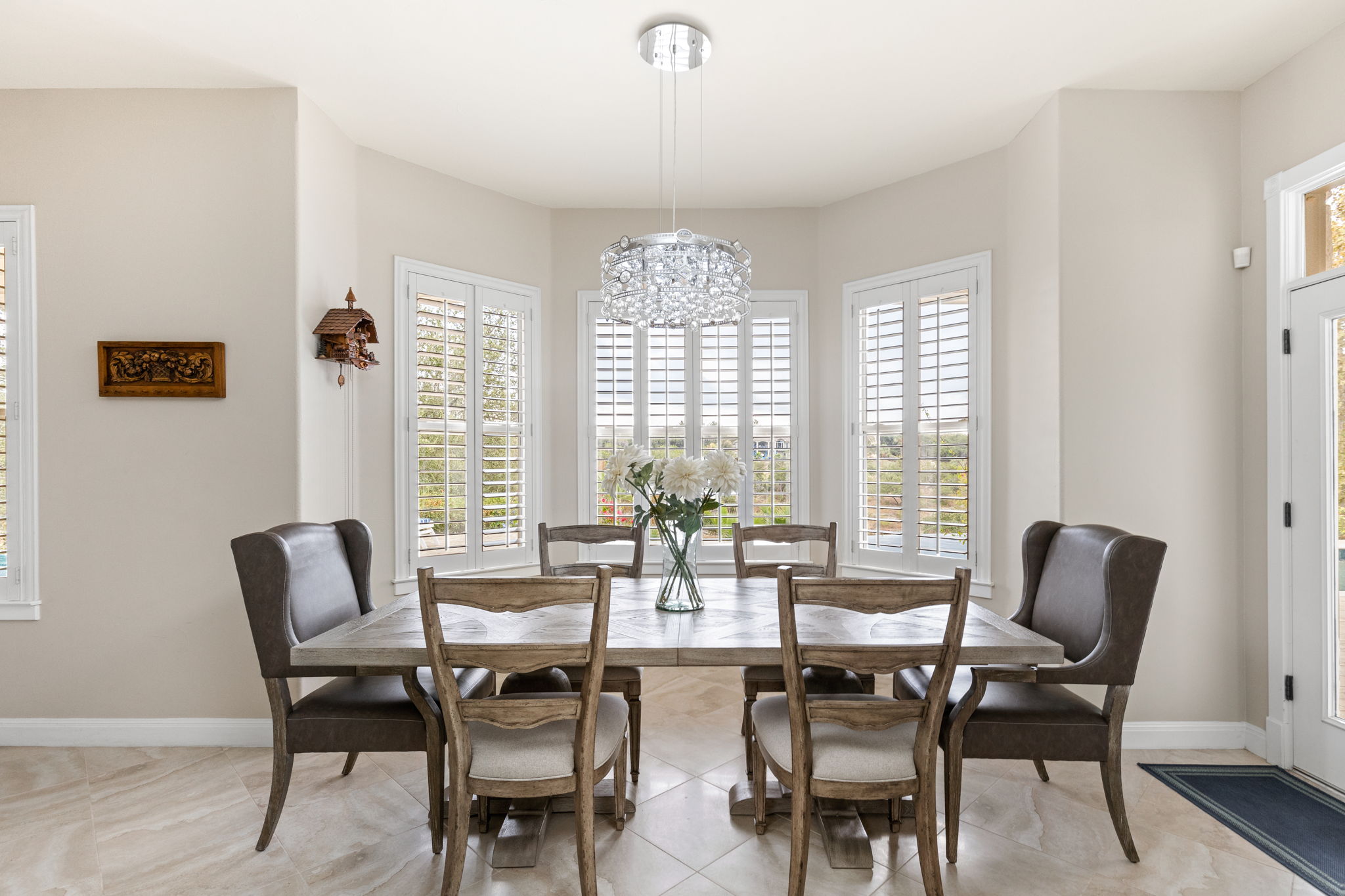 805 Brooks Hollow Road Lakeway, TX 78734 - Photo 12 of 38 a view of a dining room with furniture windows and wooden floor