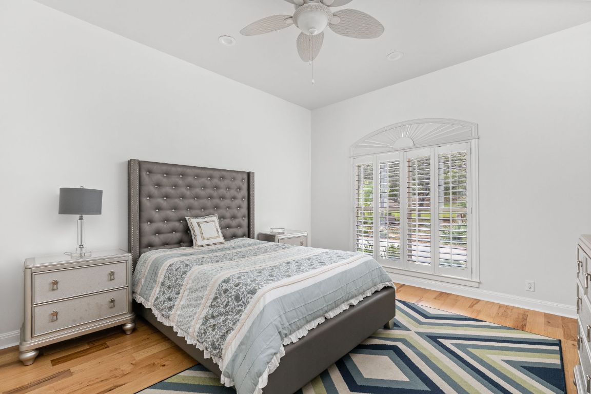 805 Brooks Hollow Road Lakeway, TX 78734 - Photo 15 of 38 a bedroom with a bed and a window