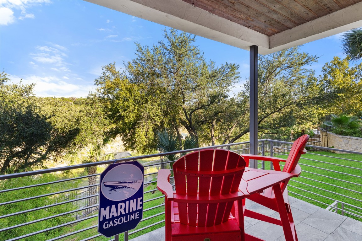 805 Brooks Hollow Road Lakeway, TX 78734 - Photo 18 of 38 a view of a chairs and table in the patio