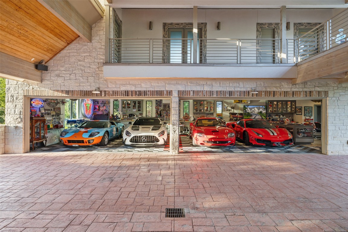 805 Brooks Hollow Road Lakeway, TX 78734 - Photo 19 of 38 a view of a cars park in front of building